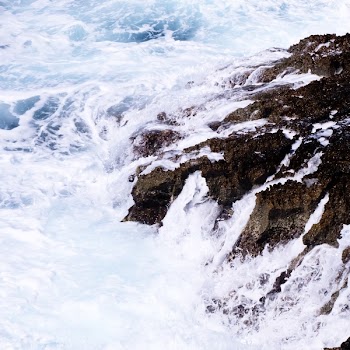 Ocean Waves Crashing on Rock Formation