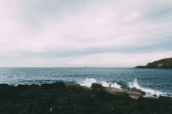 ocean waves near rock formation