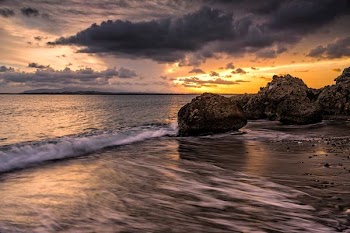 ocean waves on seashore during sunset
