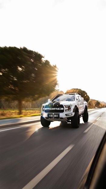 Off-Road Adventure: Modified Truck on Open Road