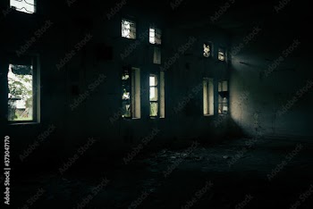 old abandoned building with light coming from the windows