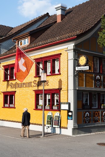 Old man strolling through Appenzell, Switzerland
