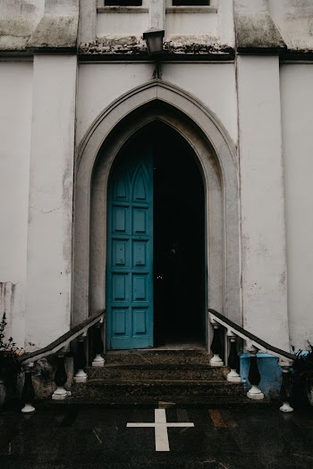 Old vintage blue open wooden door