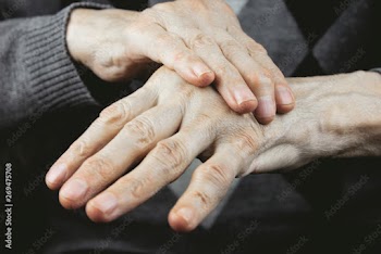 old woman's arm hurts