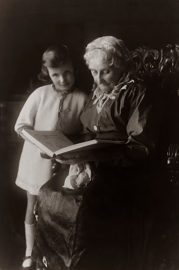 Old Woman Sitting on Chair Near Girl While Reading A Book