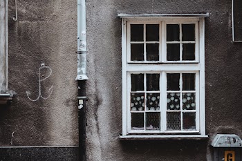 Old wooden window in an old tenement house
