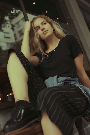 One Unknown Celebrity in Black Crew-neck Shirt and Pants