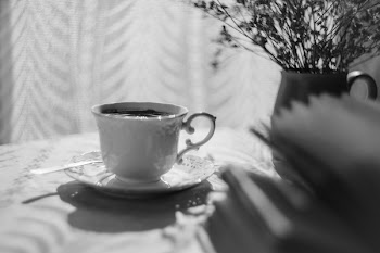 Open book and a cup of coffee