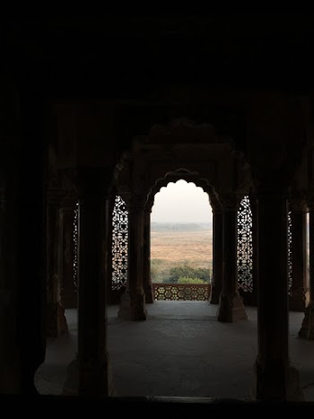 Open Field Through Arch Building