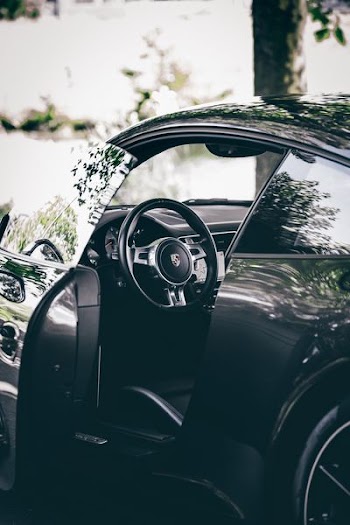 opened black sports car during daytime