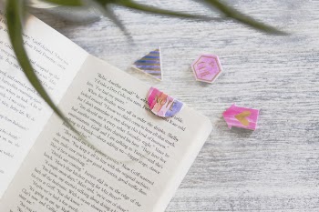 Opened Book With Pink Note Bookmark