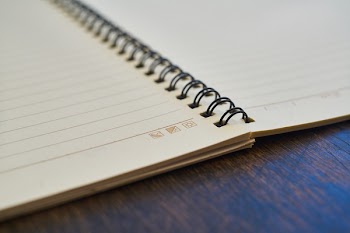 Opened White Ruled Notebook