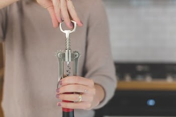 Opening A Bottle Of Wine