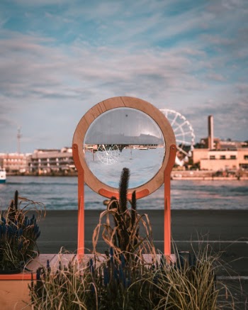 Optical art installation with a half-filled water lens in Helsinki harbour. 