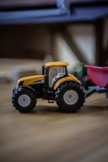 Orange and Black Front Loader Plastic Toy