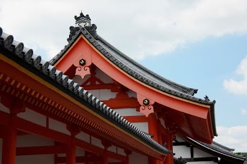 orange and gray castle under white and blue sky at daytime