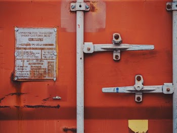 orange and gray metal container with locks