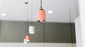 orange and white pendant mounted on ceiling