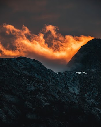 Orange Cloud Above Rocky Mountain during Sunset