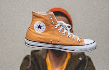 Orange Converse All-star High-top in Mid Air