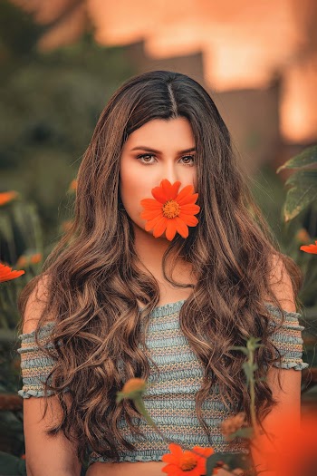 Orange Flower on Woman's Lips