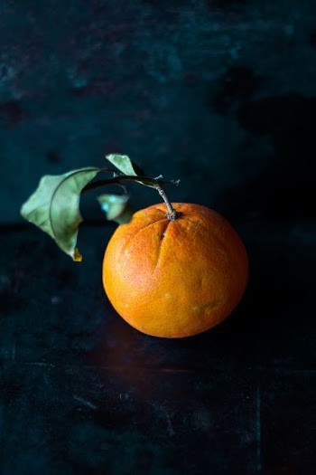 orange fruit on black panel