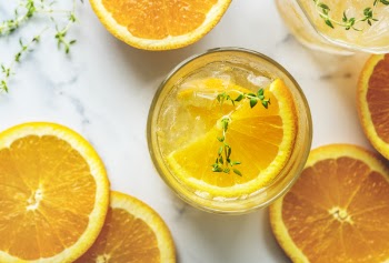 Orange Fruit on Clear Glass Bottle