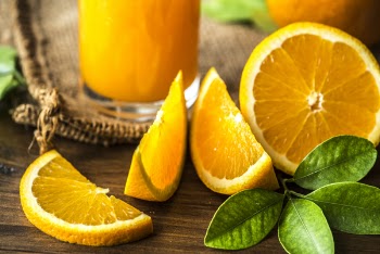 Orange Fruits on Brown Wooden Surface