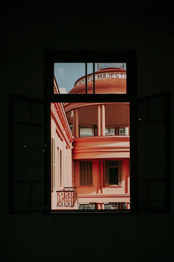 Orange Painted Building Through Window