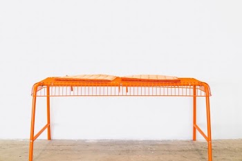orange steel scaffolding on brown surface