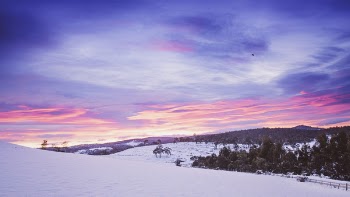 Orange Sunset and Snow Field