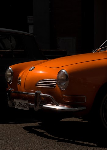 Orange Volkswagen Karmann Ghia Near Building
