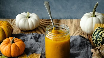 Organic pumpkin puree in glass jar pie ingredient closeup