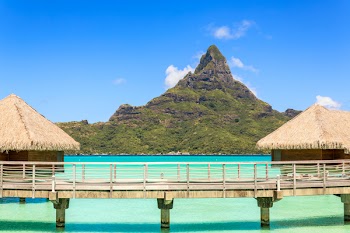 Otemanu mountain view and traditional overwater bungalows with stunning lagoon at Bora-Bora, Tahiti, French Polynesia