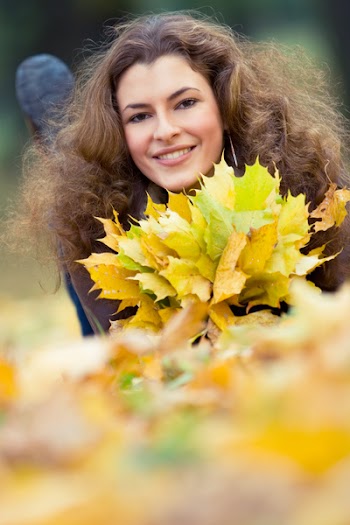 outdoor portrait of smiling young woman, with copyspace