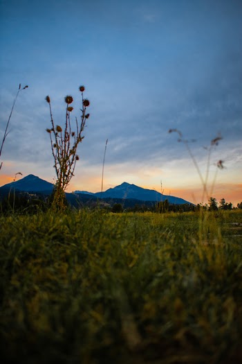 Overlooking View of Mountains Under Dark Clouds