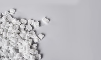 Packing Peanuts On Left Of White Table