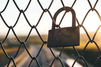 Padlock on Chain Link Fence