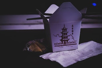 pagoda-printed gable carton on brown surface