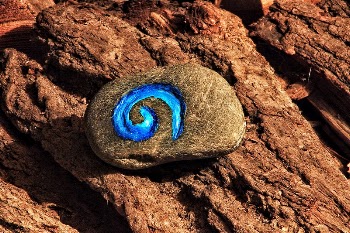 Painted stone on a rock. | Free Photo - rawpixel