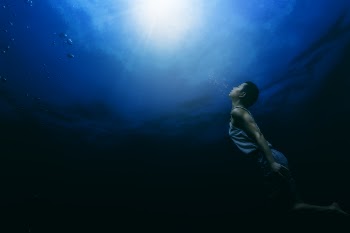 Painting of a Person Swimming Underwater