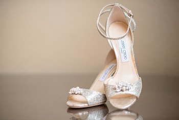 Pair of Beige-and-gray Jimmy Choo Sandals on Black Surface