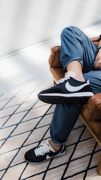 Pair of Black And White Nike Sneakers