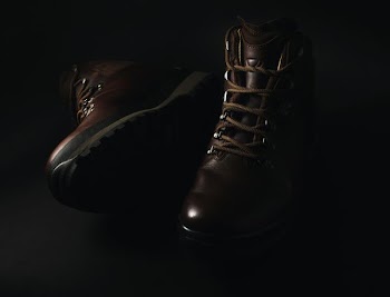pair of brown leather lace-up combat boots
