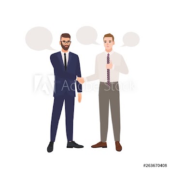 Pair of businessmen dressed in business suits standing, talking to each other and shaking hands