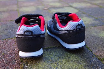 Pair of Gray-black-and-red Nike Sneakers