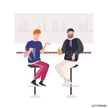 Pair of happy friends sitting on stools at bar counter and drinking beer or alcoholic beverages
