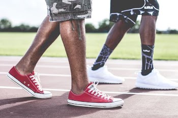 pair of red low-top shoes