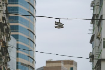 Pair of Shoe on Street Electric Cable