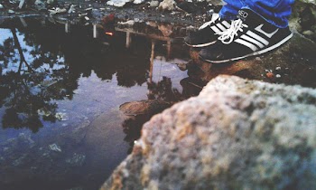 Pair of Shoes Hanging on Wind